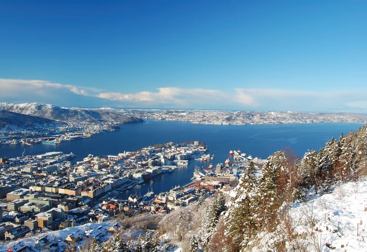 View over Bergen and its harbour from Mount Fløyen after winter snowfall